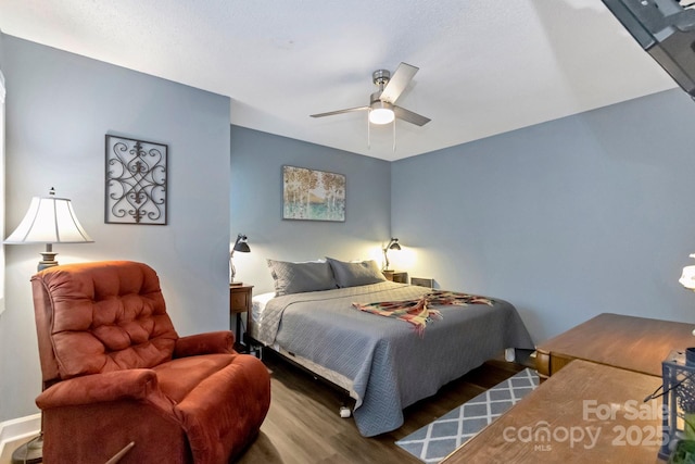 bedroom featuring hardwood / wood-style floors and ceiling fan