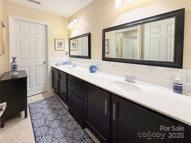 bathroom with tile patterned flooring and vanity