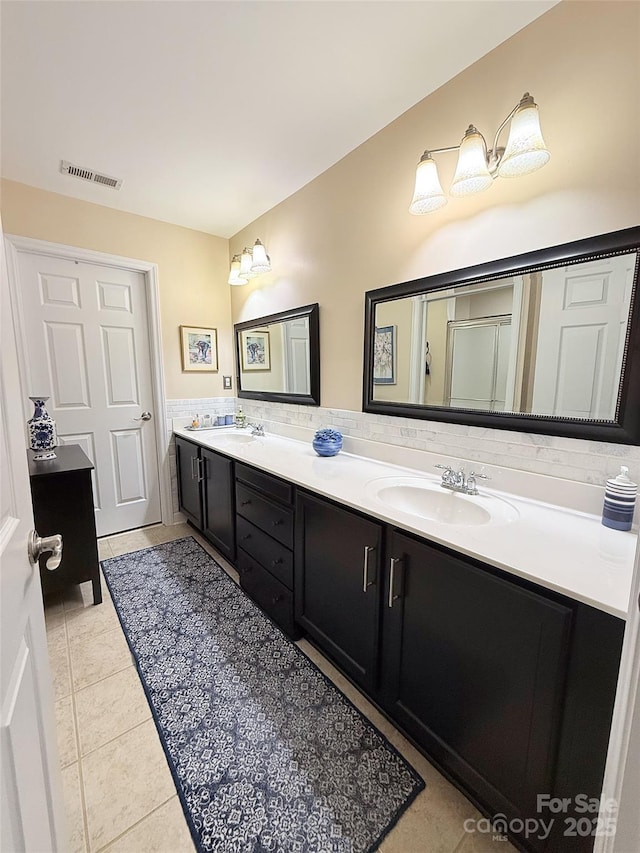 bathroom featuring tile patterned floors and vanity