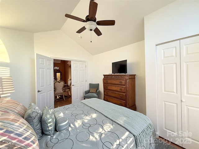 bedroom featuring vaulted ceiling, ceiling fan, and a closet