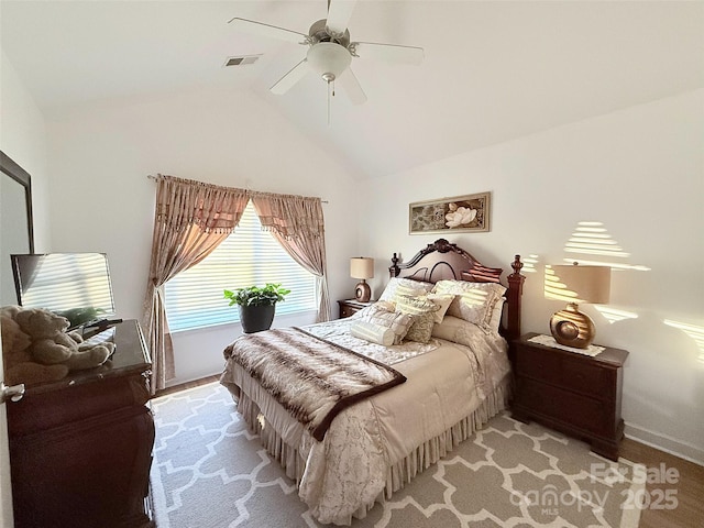 bedroom with ceiling fan and vaulted ceiling