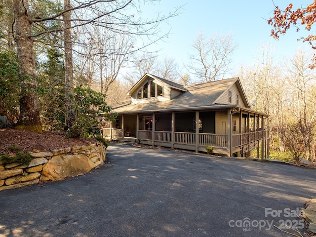 country-style home with a sunroom