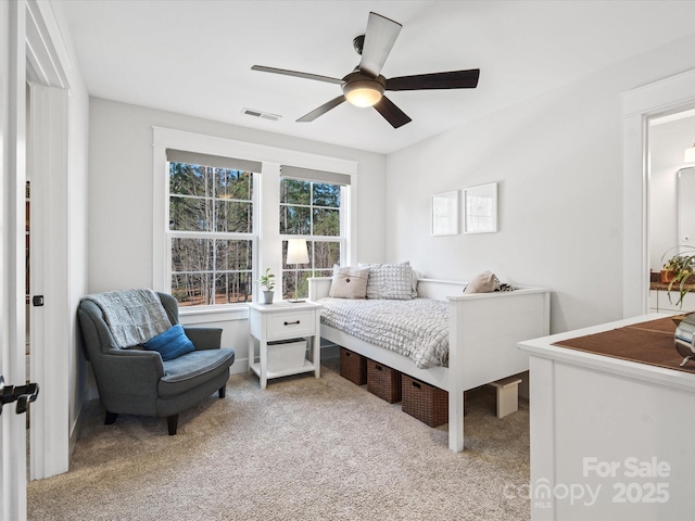 bedroom featuring light carpet and ceiling fan