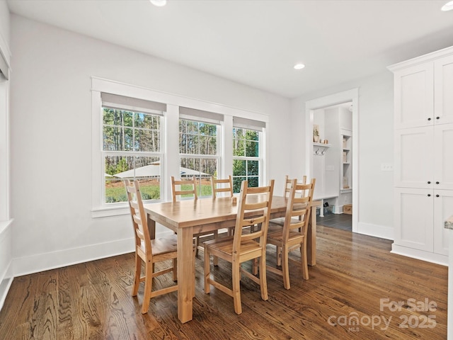 dining space with dark wood-type flooring