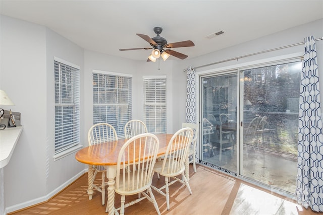 dining room featuring hardwood / wood-style flooring and ceiling fan