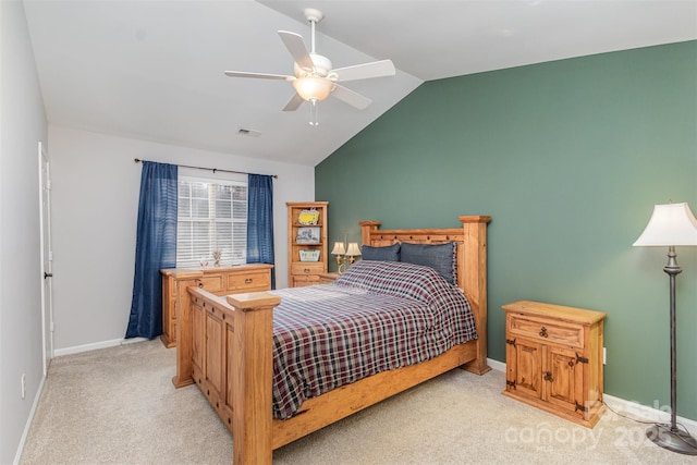 carpeted bedroom with vaulted ceiling and ceiling fan