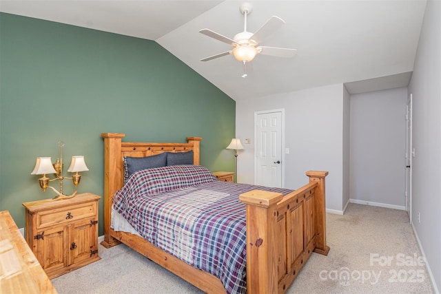 bedroom with vaulted ceiling, light colored carpet, and ceiling fan