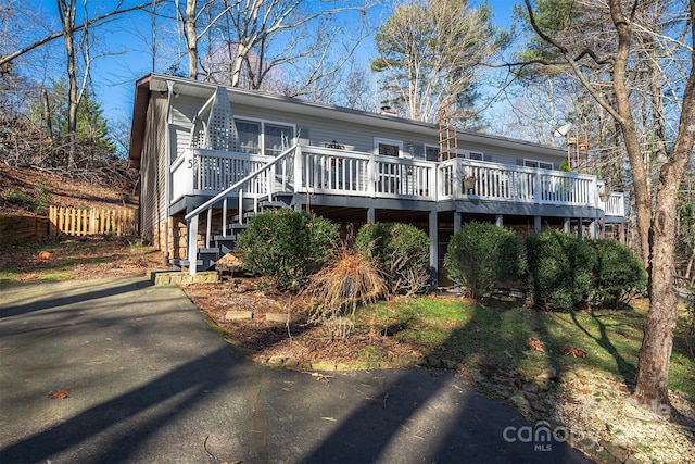 view of front of property with a wooden deck