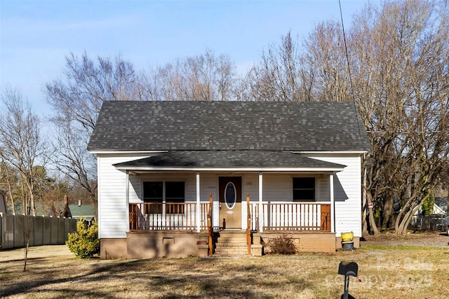 view of front facade with a front yard and a porch