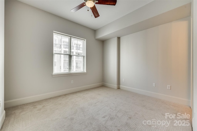 empty room with light carpet and ceiling fan