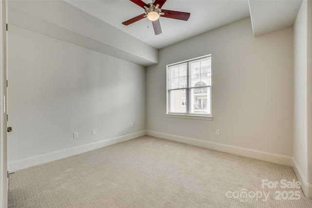 carpeted empty room with ceiling fan