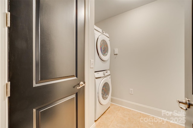 washroom with stacked washer and dryer