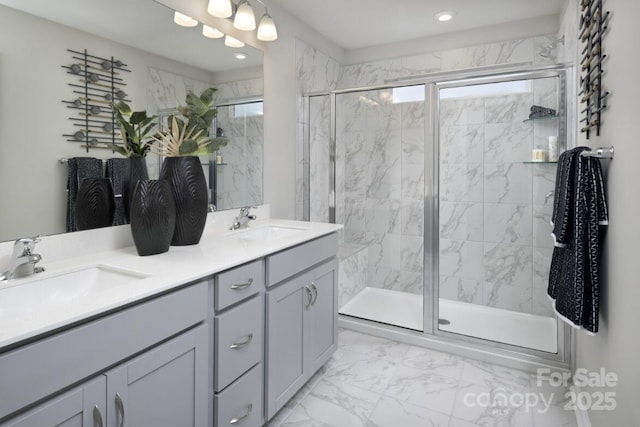 bathroom featuring vanity and an enclosed shower