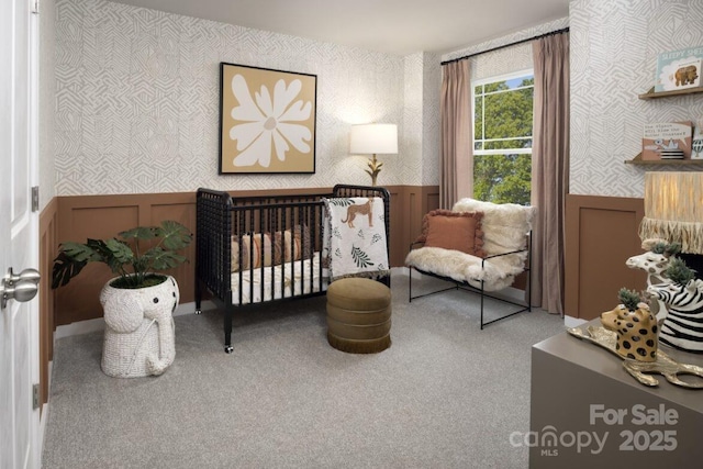 carpeted bedroom with a crib