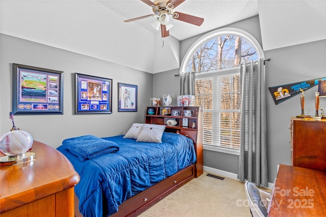 bedroom featuring lofted ceiling, carpet, and ceiling fan