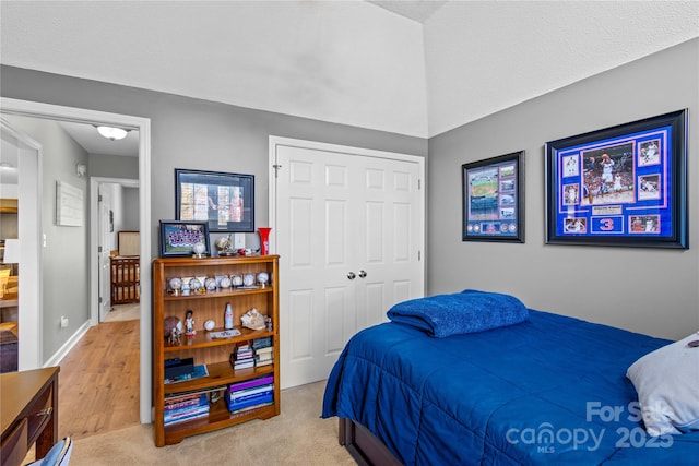 carpeted bedroom with a closet