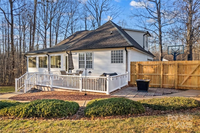 rear view of property with a patio area and a deck