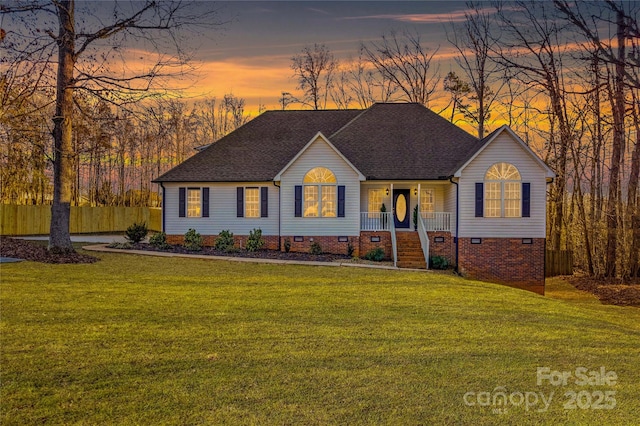 view of front of house with a lawn and covered porch