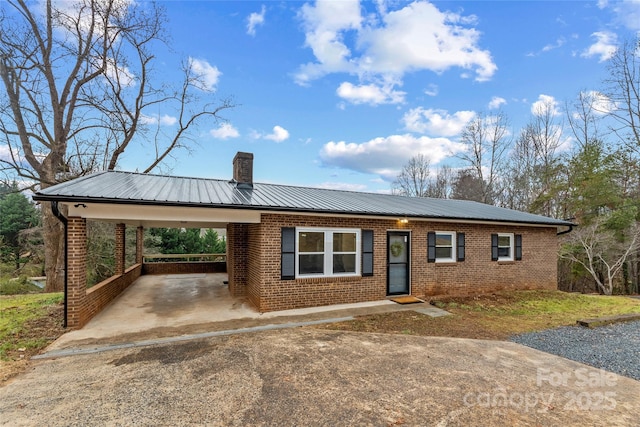 ranch-style home with a carport