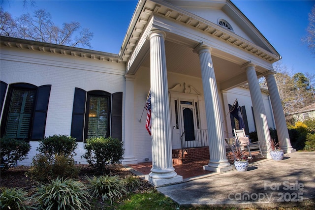 property entrance with covered porch