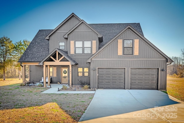 view of front of property featuring a garage and covered porch