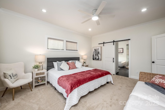 carpeted bedroom featuring crown molding, a barn door, connected bathroom, and ceiling fan