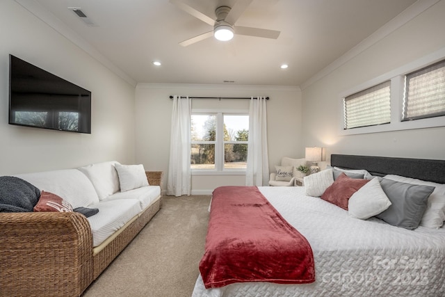 carpeted bedroom with crown molding and ceiling fan