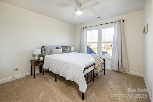 bedroom featuring ceiling fan and light carpet