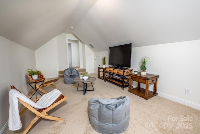 interior space featuring vaulted ceiling and light colored carpet