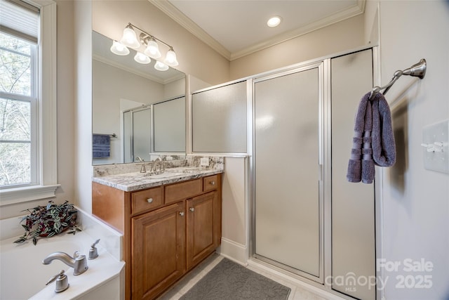 bathroom with vanity, crown molding, and independent shower and bath