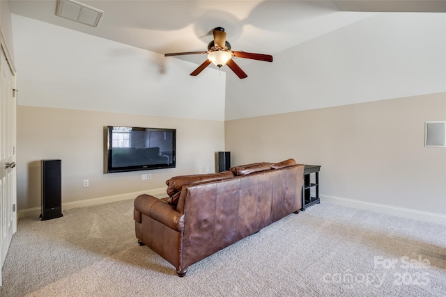 carpeted living room featuring vaulted ceiling and ceiling fan