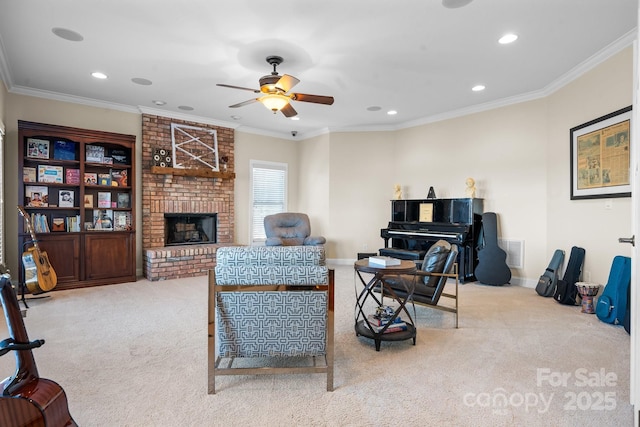 carpeted living room featuring ceiling fan, ornamental molding, and a brick fireplace