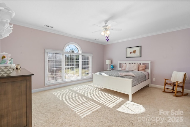 bedroom featuring ceiling fan, light colored carpet, and crown molding