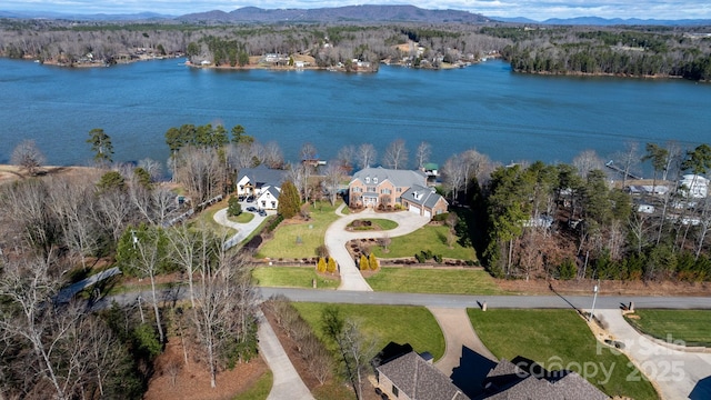 bird's eye view with a water and mountain view