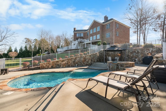 view of swimming pool featuring an in ground hot tub, a gazebo, and a patio