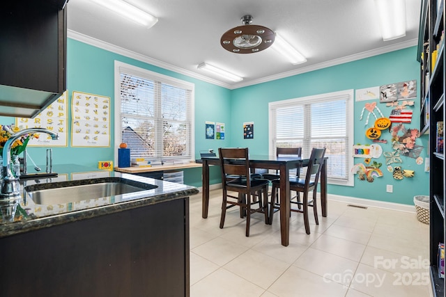 dining space featuring visible vents, ornamental molding, and a healthy amount of sunlight
