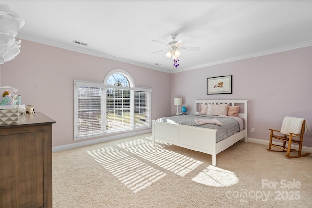 bedroom with baseboards, visible vents, light carpet, and ornamental molding