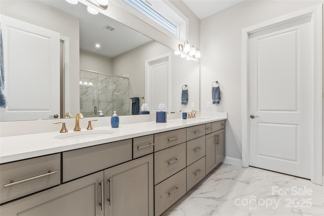 bathroom with a shower with door and vanity