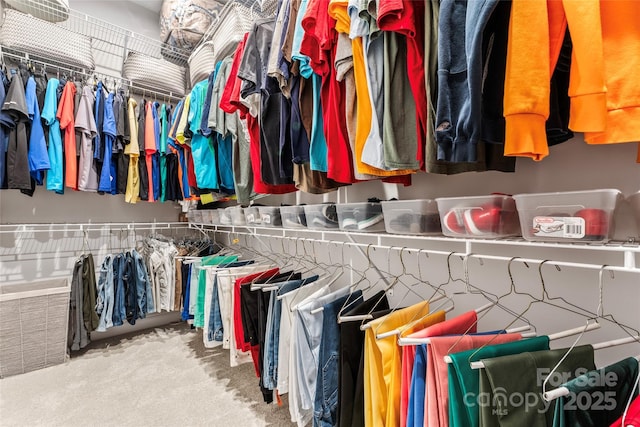 walk in closet featuring carpet