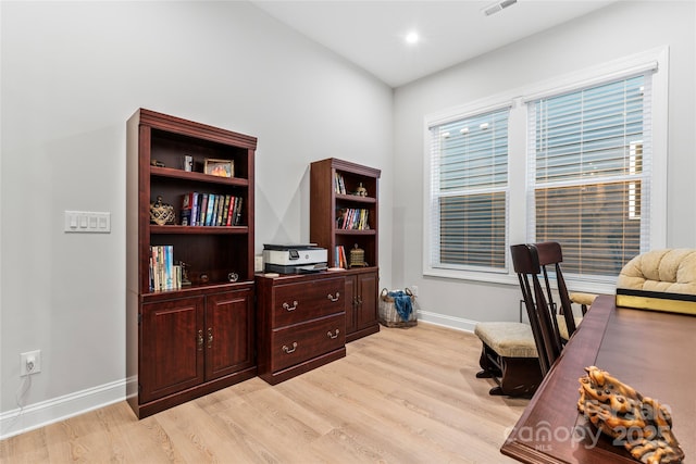 office space with light hardwood / wood-style flooring