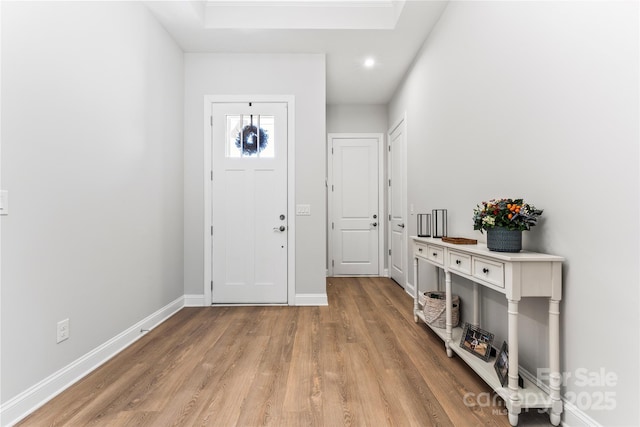 foyer entrance with light hardwood / wood-style flooring