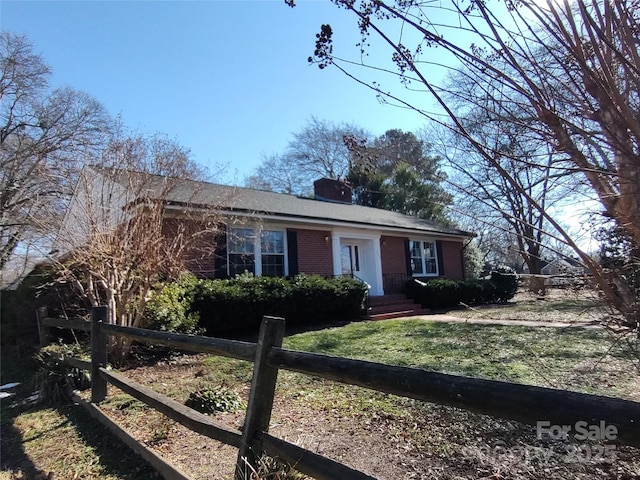 ranch-style house with a front yard