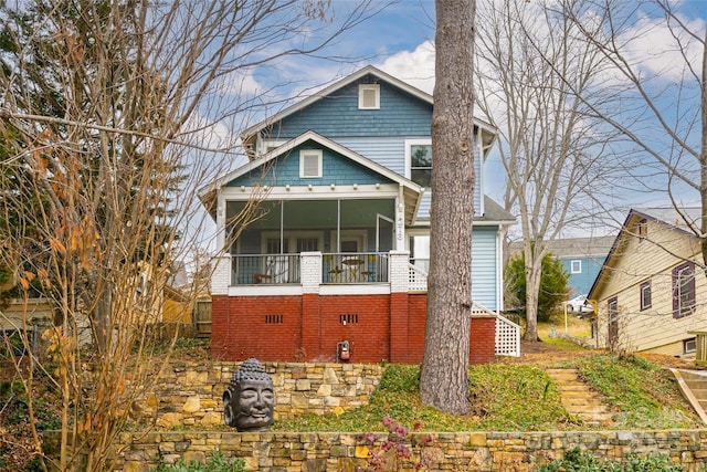 view of front of property with a sunroom