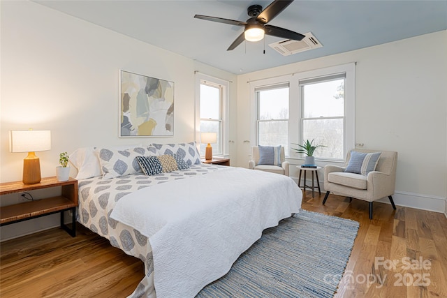 bedroom featuring ceiling fan and hardwood / wood-style floors