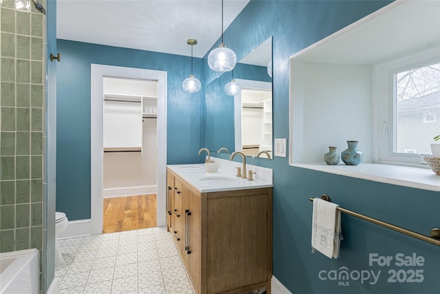 bathroom featuring toilet and vanity