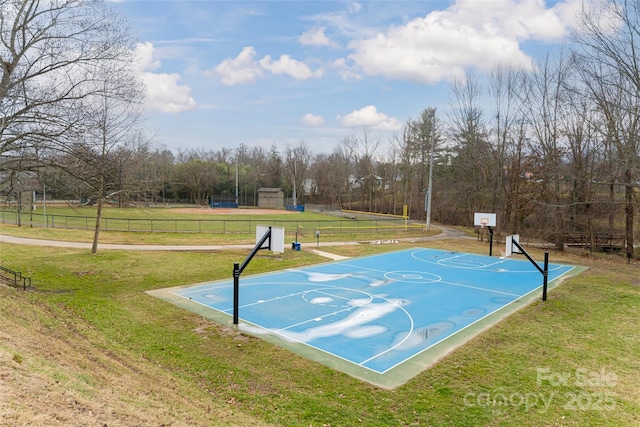 view of basketball court featuring a lawn