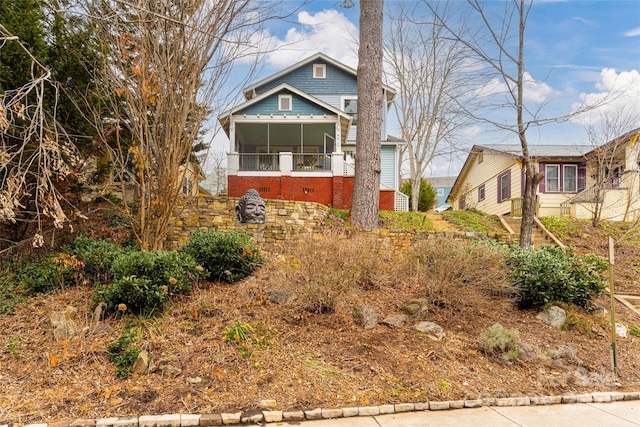 view of front of property with a sunroom