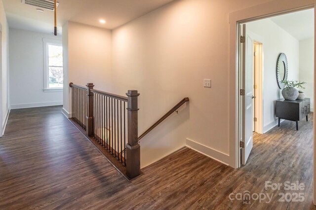 stairway featuring hardwood / wood-style flooring