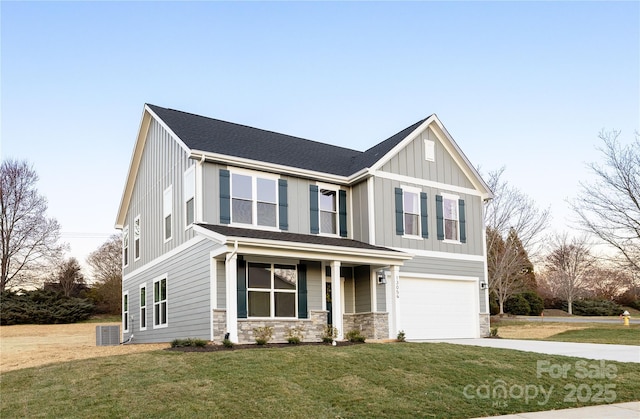 view of front facade featuring concrete driveway, board and batten siding, central AC, a garage, and stone siding