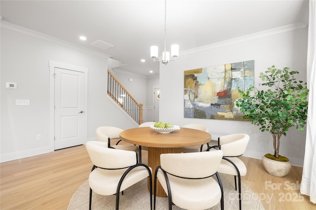 dining area featuring ornamental molding, stairs, light wood-type flooring, a chandelier, and recessed lighting